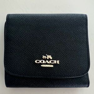 Like new black leather Coach tri fold wallet